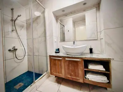 a bathroom with a sink and a shower at Niki's House in Limassol