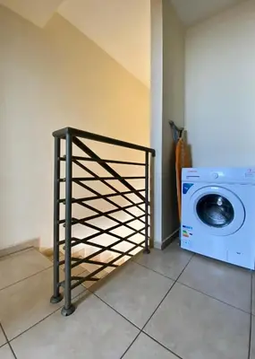 a laundry room with a washer and a washing machine at Sunny Cyprus in Paralimni