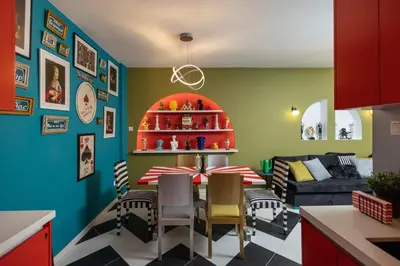 a kitchen and living room with a table and chairs at Castle Holiday Apartments in Limassol
