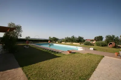 a swimming pool in the middle of a yard at Villa Vasa in Vasa Kilaniou