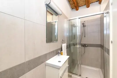 a bathroom with a shower and a toilet and a sink at Annis House in Kato Lefkara