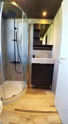 a bathroom with a shower and a sink at Perneia Rooms in Askas