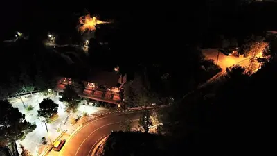 an overhead view of a street at night at Perneia Rooms in Askas