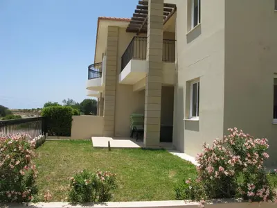 a view of a building with a yard at Pyla Gardens D5 in Pyla