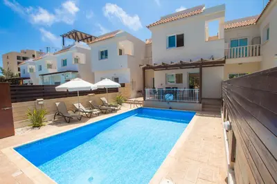 a swimming pool in front of a villa at myExclusiveVilla 683 in Protaras