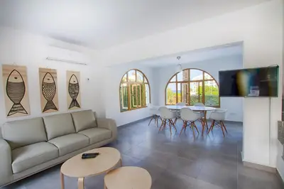 a living room with a couch and a table at Fig Tree Bay Villa 2 in Protaras