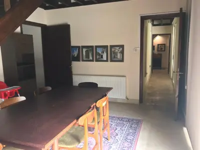 a dining room with a black table and chairs at Agia Mavri House in Koilani