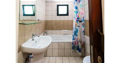 a bathroom with a sink and a bath tub at Urban Stays in Ayia Napa