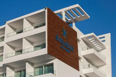 a building with a sign on the side of it at Gaia Sun N Blue Hotel in Ayia Napa