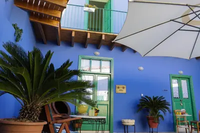 a blue room with a green door and a blue wall at To Konatzi tis Marikas tzai tou Yianni in Kato Drys