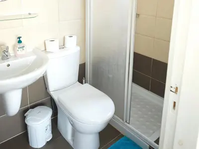 a bathroom with a toilet and a sink and a shower at Villa Chrysa in Protaras