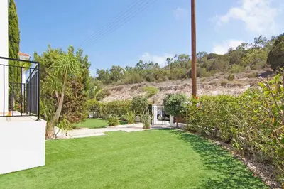 a garden with green grass and trees at Villa Anette in Protaras