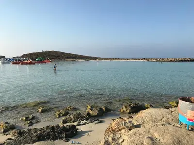 a person standing in the water at the beach at Villa Nissi Beach 28 in Ayia Napa