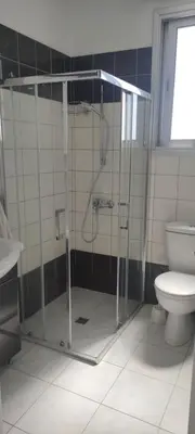 a bathroom with a shower and a toilet at Kiti Village Villa, Cyprus, salt-water pool, 5 bedrooms, Larnaca in Kiti