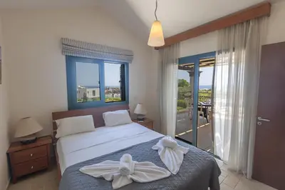 a bedroom with a bed with a bow on it at Spetses Villa 5 in Protaras