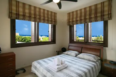 a bedroom with a bed with two towels on it at Villa Leonidas in Protaras