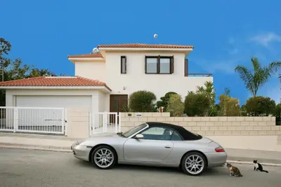 a silver car parked in front of a house at Villa Leonidas in Protaras