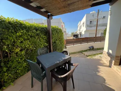 a table and two chairs on a patio at George Apartments in Ayia Napa