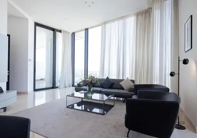 a living room with a couch and a table at Nicosia Central Park Residences in Nicosia