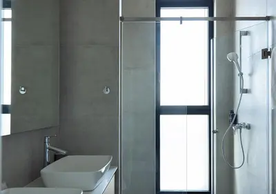 a bathroom with a toilet and a sink and a shower at Nicosia Central Park Residences in Nicosia