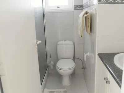 a small bathroom with a toilet and a sink at Villas Ithaca Protaras in Protaras