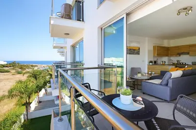 a balcony with a view of the ocean at Apartment Victoria in Protaras