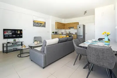 a living room with a couch and a table at Apartment Victoria in Protaras