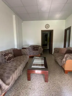 a living room with two couches and a coffee table at Christos House in Kakopetria