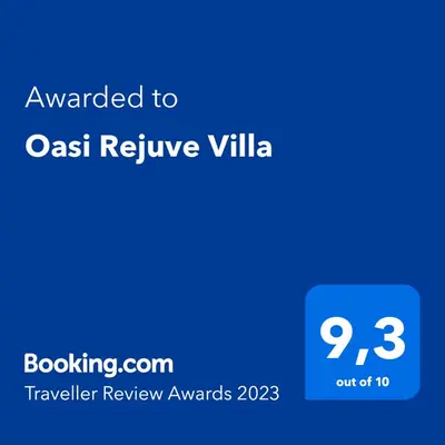 a blue screen with the text awarded to cast relieve villa at Oasi Rejuve Villa in Meneou