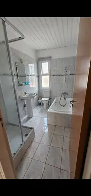 a bathroom with a tub and a toilet and a sink at Luxury Apartment Ayia Napa Center in Ayia Napa