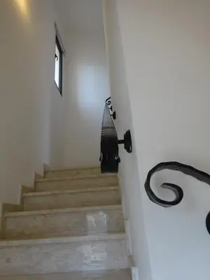 a set of stairs in a white room with a window at Cy-Blue in Protaras