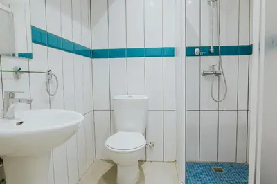 a bathroom with a toilet and a sink at Stephanie Studios in Larnaka