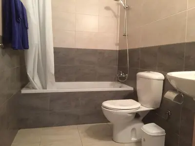 a bathroom with a toilet and a shower and a sink at Great Kings Resort Apartment 10 Block 19 in Protaras