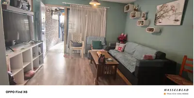 a living room with a couch and a table at Siamese Villa in Paralimni