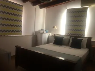 a bedroom with a large bed in a room at Villa Thermopilon in Larnaka