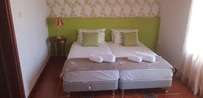 a bedroom with a bed with two pillows on it at Villa Thermopilon in Larnaka