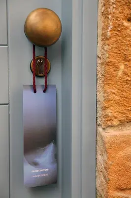 a door nob with a lock and a sign on it at Centrum Hotel - City Center in Nicosia