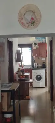 a kitchen with a sink and a stove top oven at Marina's Rooms in Larnaka