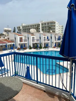 a view of a swimming pool from the balcony of a hotel at Alexia Hotel Apartments in Ayia Napa