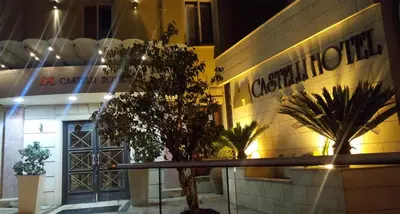 a building with a sign on the side of it at Castelli Hotel Nicosia in Nicosia