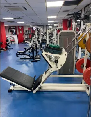 a gym with rows of treadmills and machines at Navarria Blue Hotel in Limassol