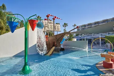 a pool with a water slide in a resort at Atlantica Oasis Hotel in Limassol