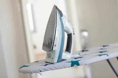 a iron sitting on top of a shelf at Myrtiana Apartments in Nicosia