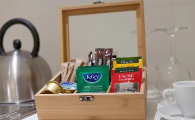 a wooden box filled with books on top of a counter at Myrtiana Apartments in Nicosia