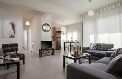 a living room with a couch and a table at Myrtiana Apartments in Nicosia