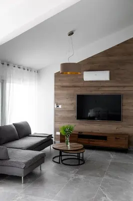a living room with a couch and a tv at Bayview Terraces in Limassol