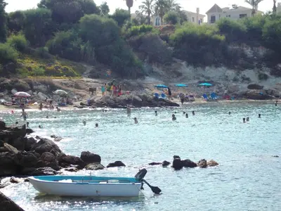 a group of people in the water at a beach at Mythical Sands Resort - Antonios in Paralimni