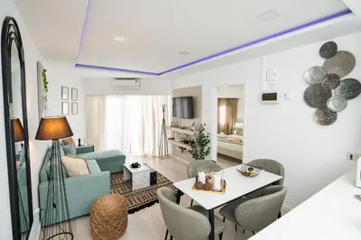 a living room with a blue ceiling at Lazuli Beach & Pool Apartment 501 in Larnaka