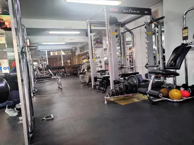 a gym with lots of equipment in a room at Almond Business Hotel in Nicosia