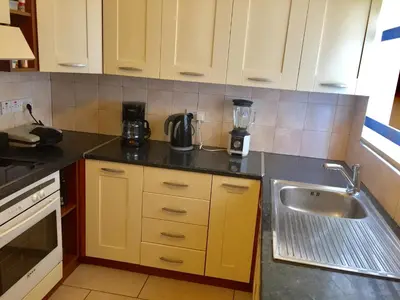 a kitchen with a sink and a counter top at Andreas Apartment in Limassol